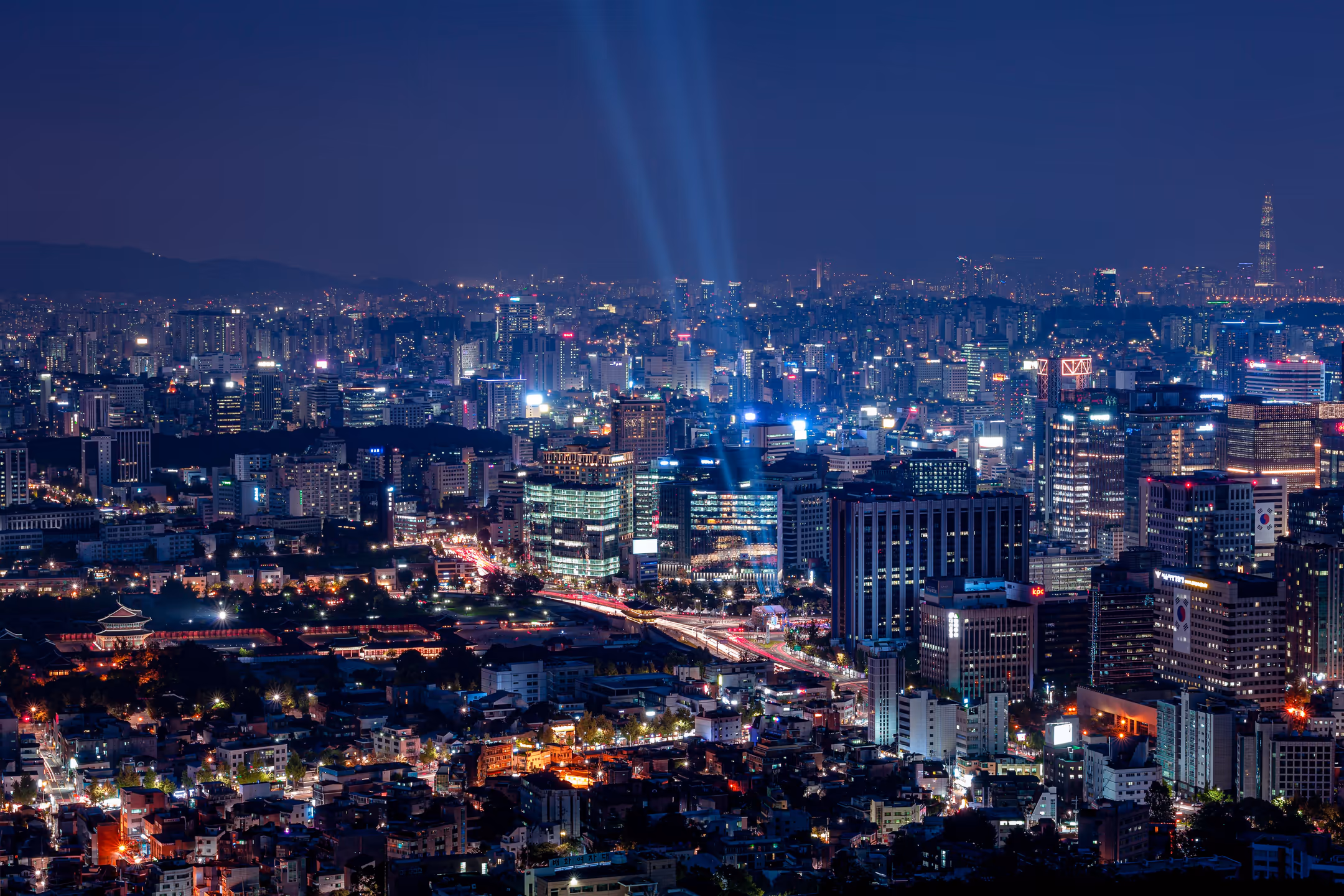 Kathmandu city at night with tall buildings lit up across the skyline