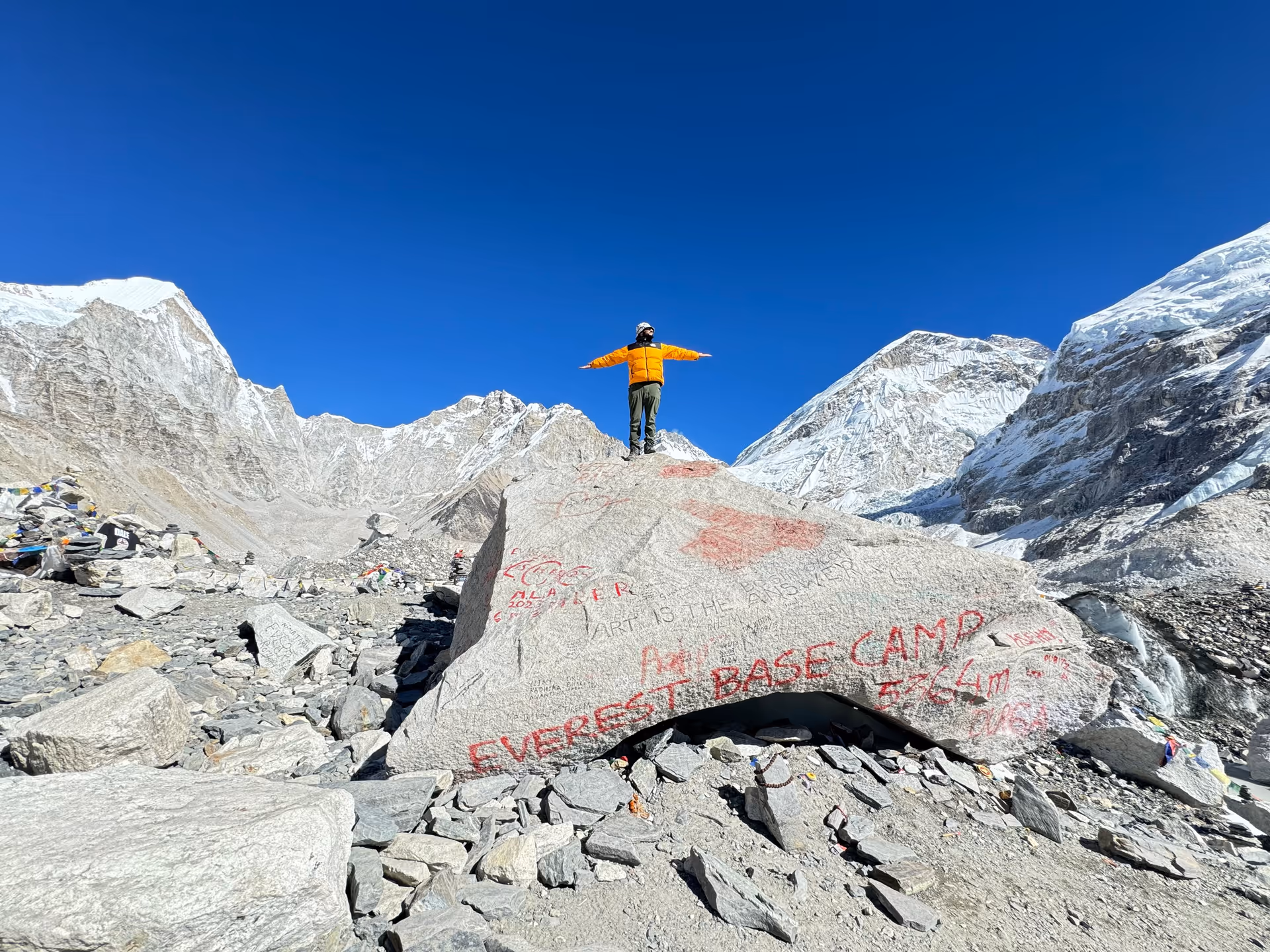 Trekker at Everest Base Camp sign
