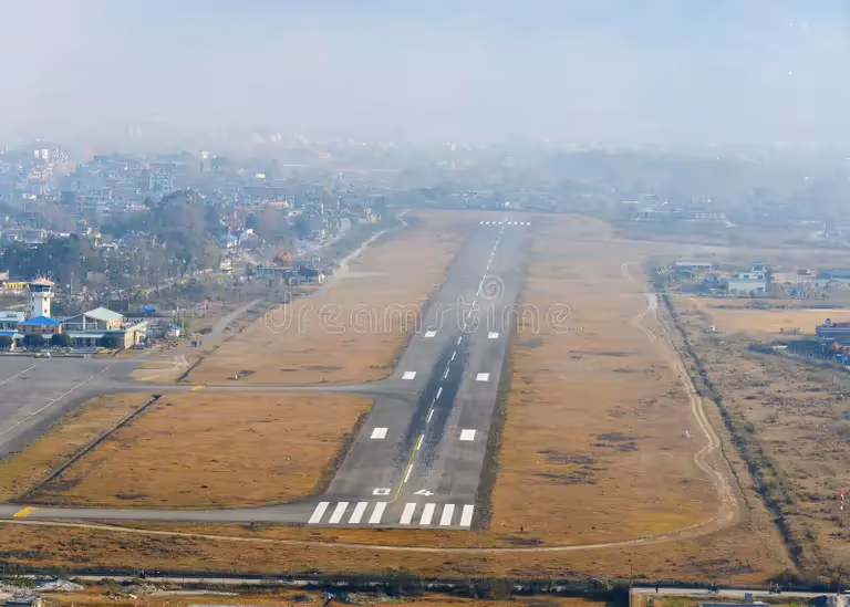Pokhara International Airport runway with hills in the background