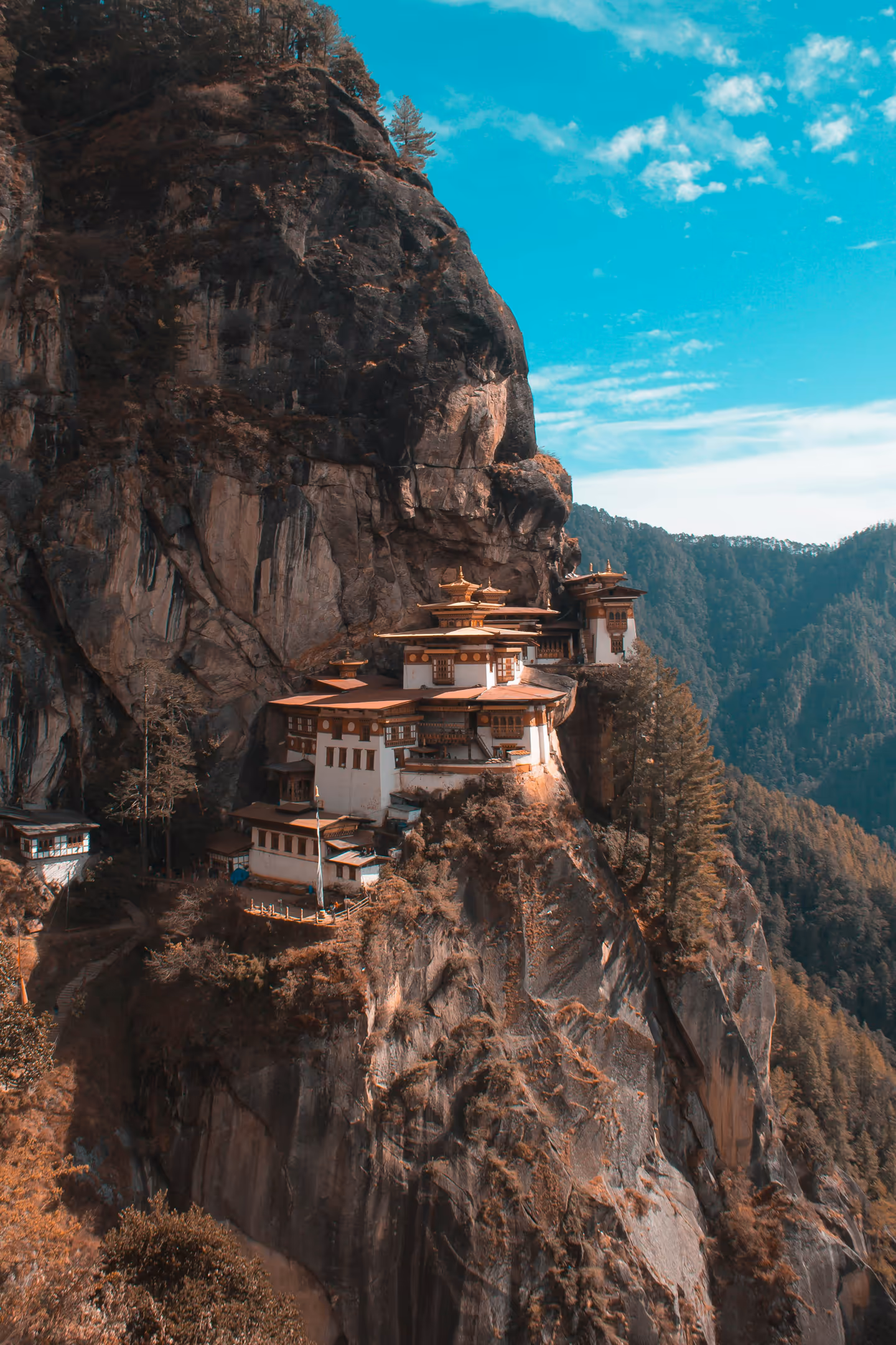 A small temple positioned on a hillside in Nepal