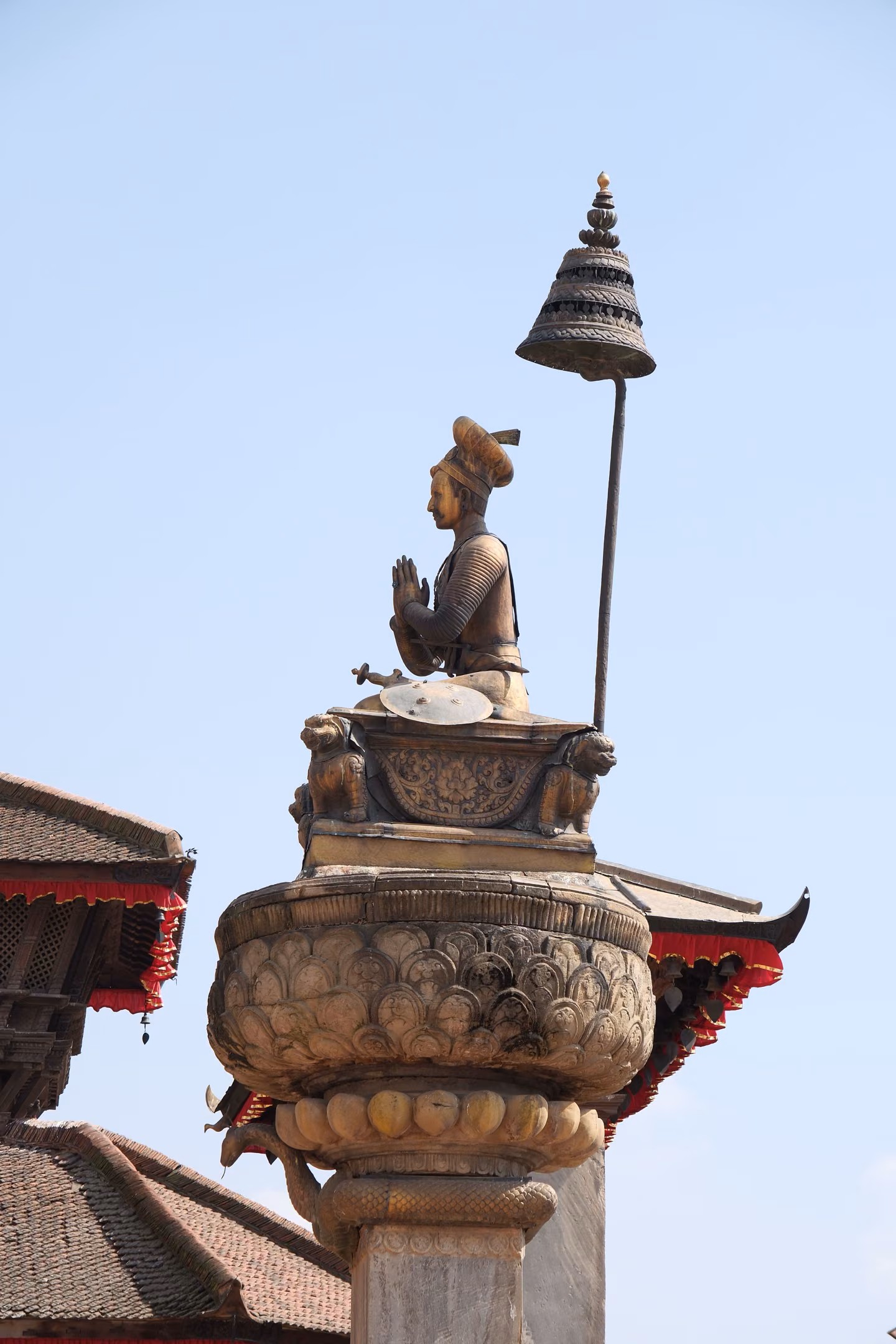 Statue of King Bhupatindra Malla on its column in Bhaktapur Durbar Square
